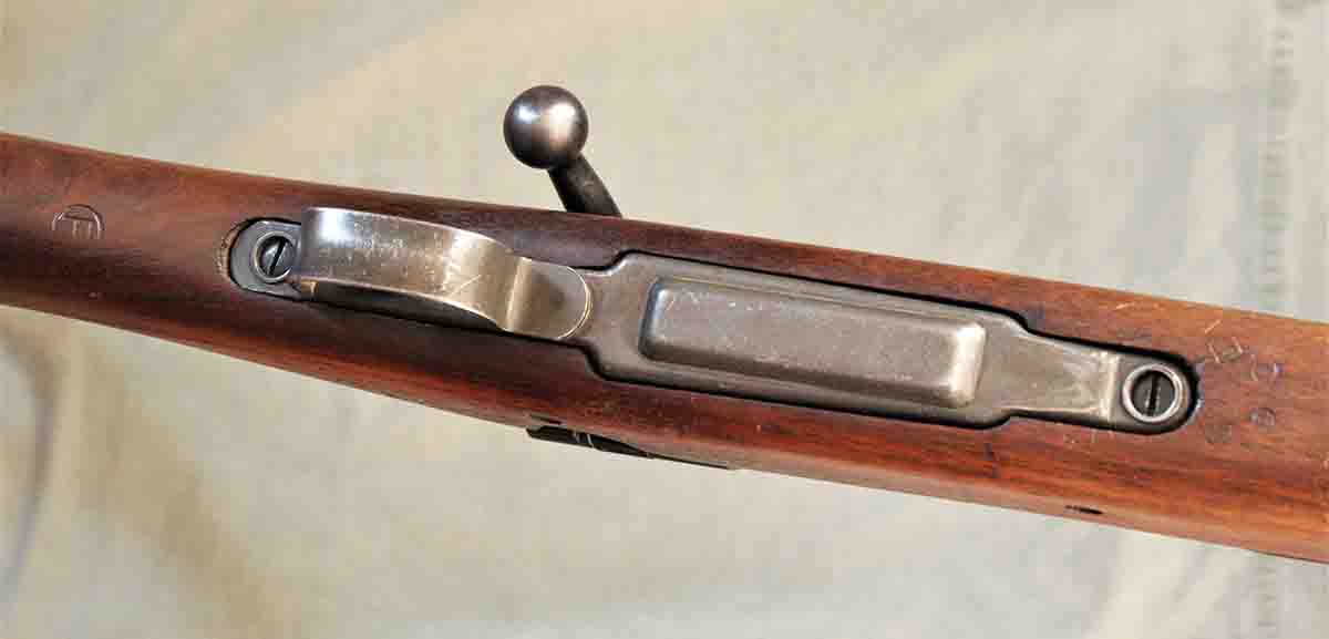 The floorplate is stamped, and unlike the original 1903’s machined floorplate, is not removable. (The P-within-a-circle proof stamp can be seen behind the trigger guard.)